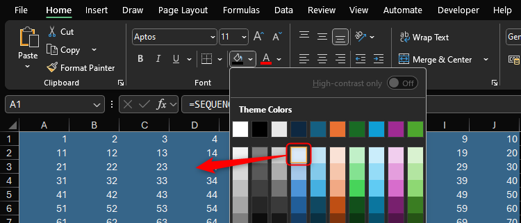 A light blue cell fill is selected in Excel while dark mode is activated, producing a dark blue fill.